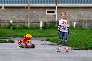 boy in a denim jacket sitting on a toy car, family and sports, toy car, spring, walk, family sport, study