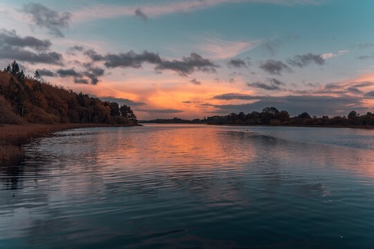 Scenic lake Muckno in County Monaghan with sunset reflecting on the water surface