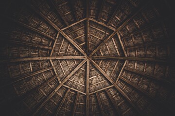 Low angle shot of the round beautiful wooden roof