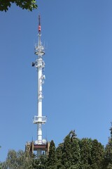Vertical shot of the Radio broadcasting mast against the blue sky