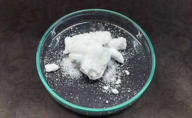 white salt powder in glass