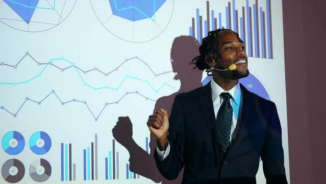 Black man giving a presentation using a projector