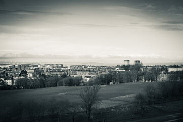 View on the city of Edinburgh, dramatic and dark,seaside from Arhur's seat, sleeping volcano, Scotland in black and white