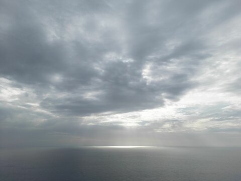 Aerial view of a sea under a cloudy sky
