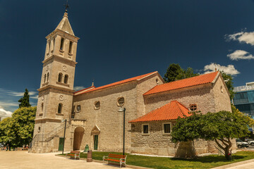 Fototapeta na wymiar Franciscan monastery with the bell tower in Sibenik. A historic town on the Dalmatian coast of Adriatic sea in Croatia, Europe