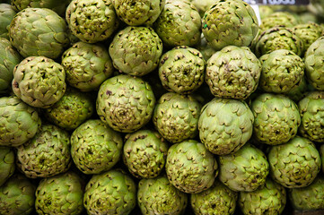 Closeup of fresh artichokes on display at the market in Valencia, Spain