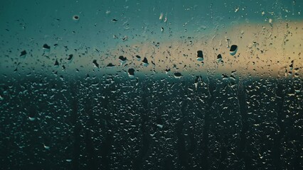 Cool tones and the soft patter of rain on a window create a meditative atmosphere during the blue hour of dusk - Powered by Adobe