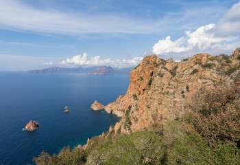 Fototapeta na wymiar Beautiful landscape of rocky hills by the water in Corsica