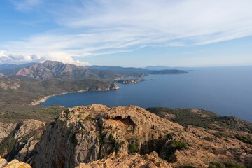 Beautiful landscape of rocky hills by the water in Corsica
