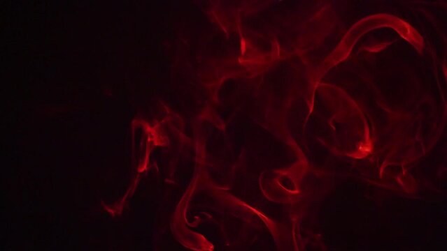 red smoke effect on a dark background
