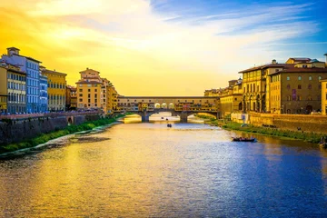 Foto auf Leinwand Ponte Vecchio in front of the sunset © Wirestock