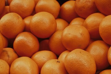 Closeup of small oranges on each other, cool for background