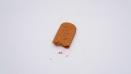 Closeup shot of the half of a cracker biscuit isolated on a white background