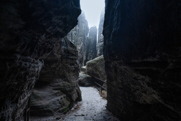 Gloomy and totally moody path lost in the foggy rocks with the best dark and mystic atmosphere in...