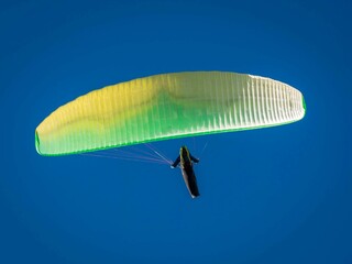 Paraglider fly in blue sky
