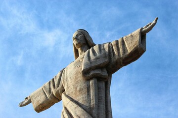 Christ the King statue (Cristo Rei) against the blue sky in Madeira, Portugal