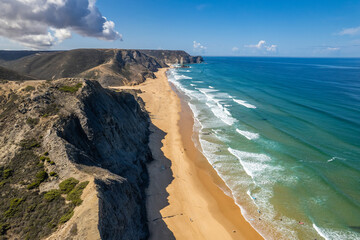 Aerial droe view of beautiful natural Cordoama beach in Portugal Atlantic coast - 781985807