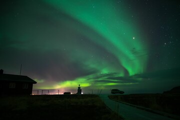 Beautiful shot of the Northern Lights over a lake in Vardo, Norway