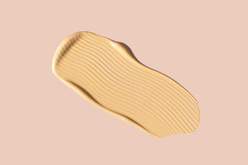 creamy cosmetic texture of golden shining color cosmetic smear close-up