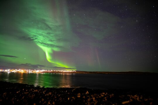 Beautiful shot of the Northern Lights over a sea in Vardo, Norway