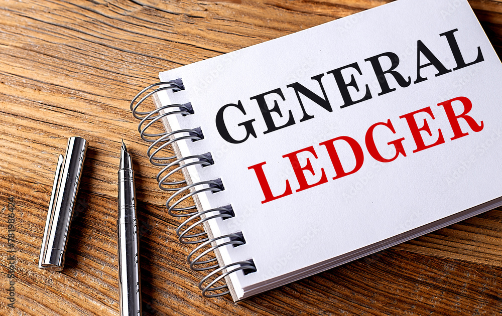 Poster general ledger text on notebook with pen on the wooden background