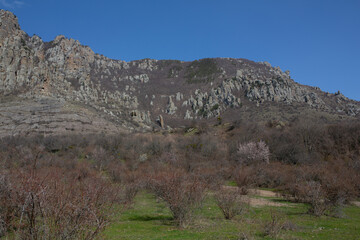 Mountains in spring Crimea against a background of blue sky and bright sunlight