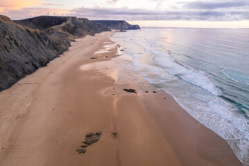 Aerial droe view of beautiful sunset at Cordoama beach in Portugal Atlantic coast - 781988023