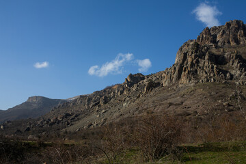 Mountains in spring Crimea against a background of blue sky and bright sunlight