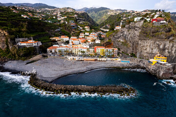Ponta do Sol in Madeira Island, Portugal. Aerial drone view at cityscape of coastal town and beach - 781988823