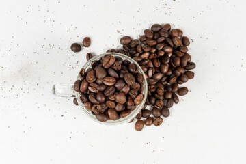 Coffee Cup Filled With Coffee Beans, Coffee Beans Spilling Over White Background - Powered by Adobe