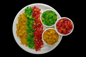 Three Lines of Colored Tutti Frutti, Also In A Small Bowl, On A White Plate, Yellow, Green, Red