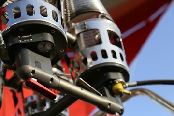 Obraz premium Selective focus closeup of flight burners against blue sky