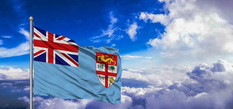 Fiji national flag cloth fabric waving on beautiful Blue Sky Background.