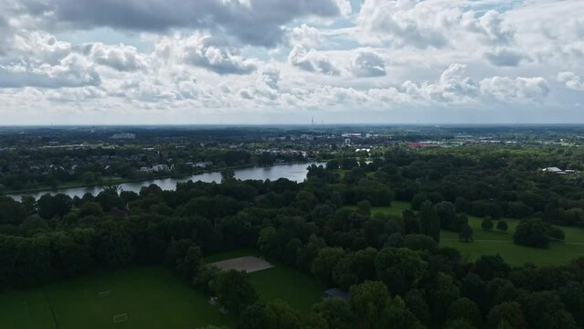 An aerial drone view of Aasee Lake in M&uuml;nster . Lake Aasee is an artificial lake located in M&uuml;nster , Germany .