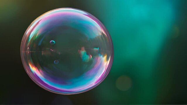 Colorful soap bubble on dark background