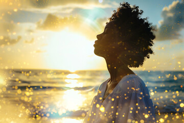 young athletic black woman meditates on sea shore, with aura of energy around, natural sea background.