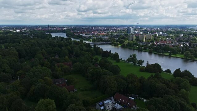 An aerial drone view of Aasee Lake in M&uuml;nster . Lake Aasee is an artificial lake located in M&uuml;nster , Germany .