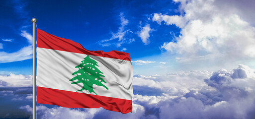 Lebanon national flag cloth fabric waving on beautiful Blue Sky Background.