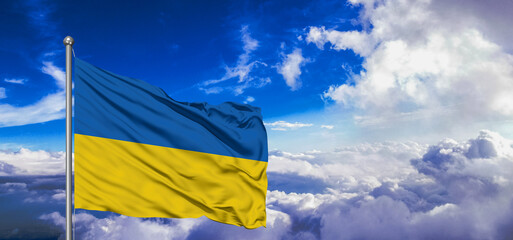 Ukraine national flag cloth fabric waving on beautiful Blue Sky Background.