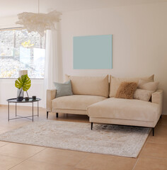 Detail of the living room with a light fabric sofa with cushions and a small table with plants next to it. Above the sofa there is space for a table.