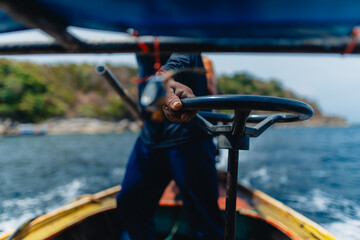 Obraz premium On a long-tail boat, go snorkeling at various islands