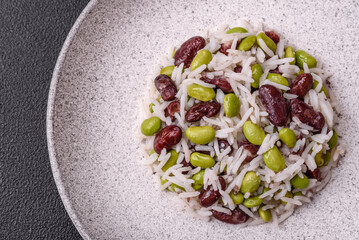 Delicious white cooked rice with green edamame beans with salt and spices