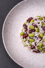 Delicious white cooked rice with green edamame beans with salt and spices