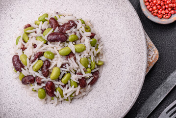 Delicious white cooked rice with green edamame beans with salt and spices