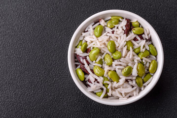 Delicious white cooked rice with green edamame beans with salt and spices