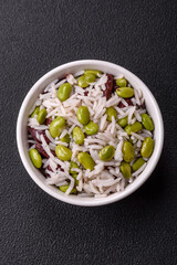 Delicious white cooked rice with green edamame beans with salt and spices