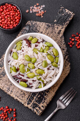 Delicious white cooked rice with green edamame beans with salt and spices