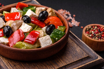 Delicious fresh juicy salad of sweet peppers, cheese, olives, tomatoes, cucumbers