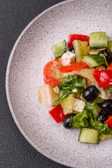 Delicious fresh juicy salad of sweet peppers, cheese, olives, tomatoes, cucumbers