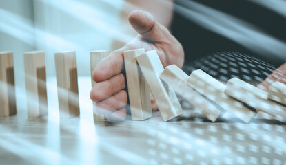 Concept of business control by stopping domino effect; light effect